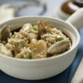 Arroz meloso de almejas, bacalao y alcachofas