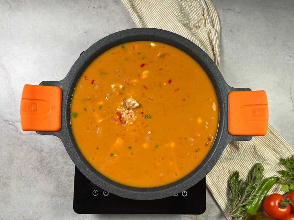 Incorporar el arroz y el caldo