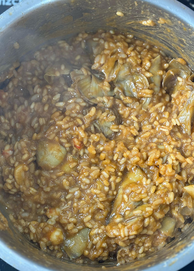 Cocinar Arroz meloso con langostinos y alcachofas